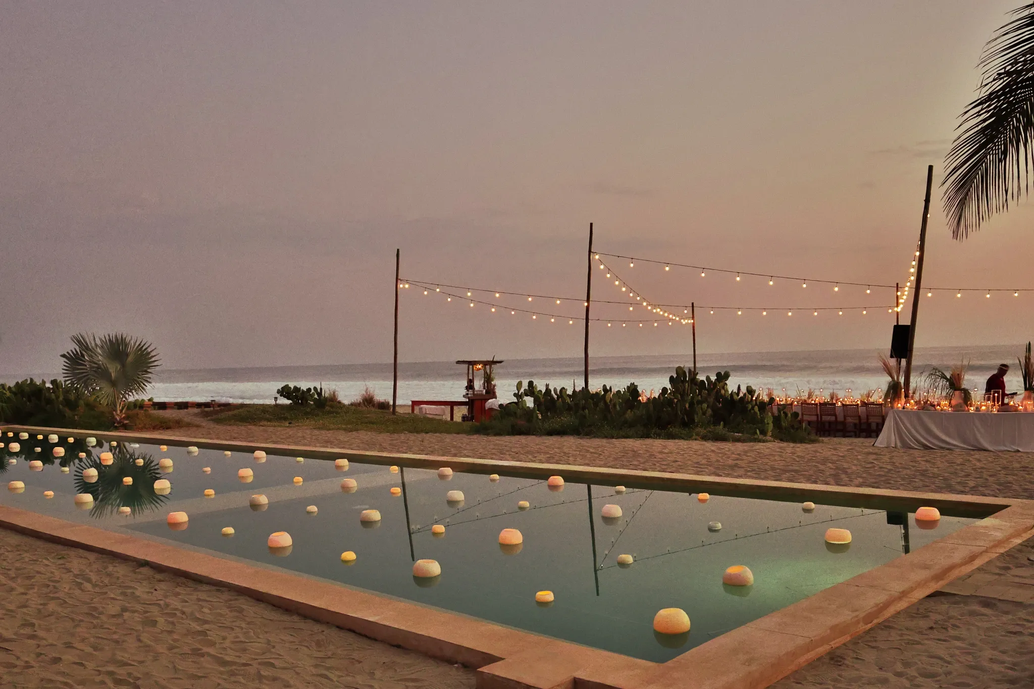 Married couple running to the sea